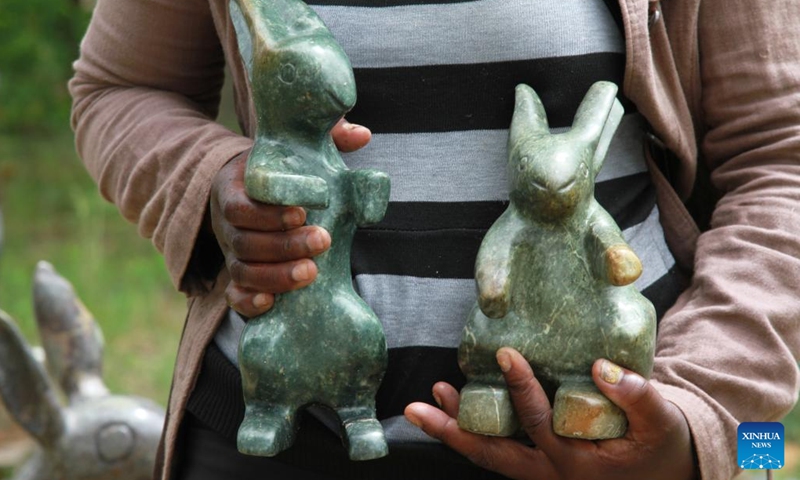 Lorraine Mamvura, an artist focusing on realistic art at Chitungwiza Arts Center, works on an artwork in Chitungwiza, a town south of Harare, Zimbabwe, on March 17, 2022.(Photo: Xinhua)