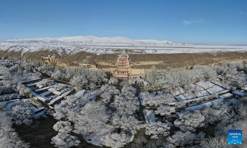 Aerial photo taken on March 25, 2022 shows the snow view of the Mogao Grottoes, a world cultural heritage site, in Dunhuang, northwest China's Gansu Province.Photo:Xinhua