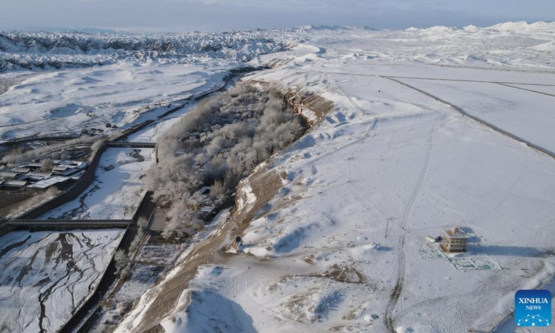 Aerial photo taken on March 25, 2022 shows the snow view of the Mogao Grottoes, a world cultural heritage site, in Dunhuang, northwest China's Gansu Province.Photo:Xinhua