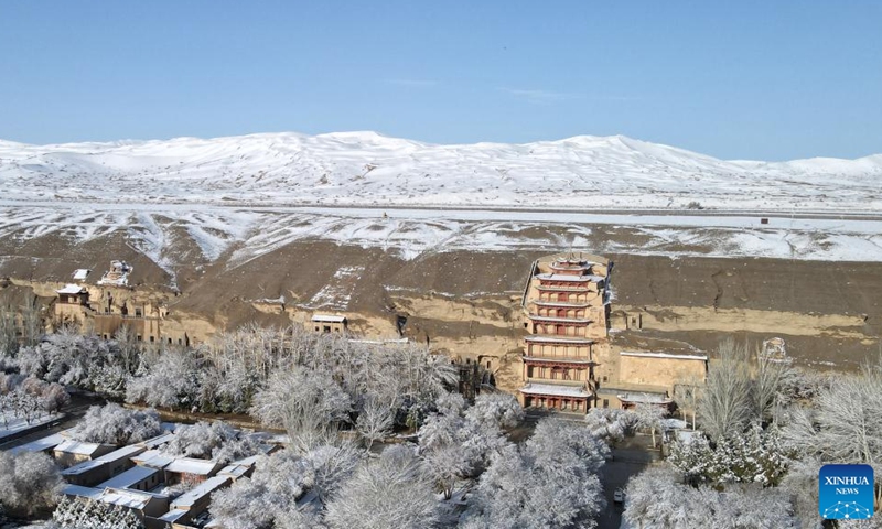 Aerial photo taken on March 25, 2022 shows the snow view of the Mogao Grottoes, a world cultural heritage site, in Dunhuang, northwest China's Gansu Province.Photo:Xinhua