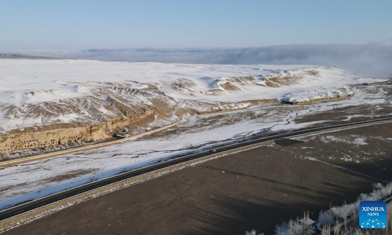 Aerial photo taken on March 25, 2022 shows the snow view of the Mogao Grottoes, a world cultural heritage site, in Dunhuang, northwest China's Gansu Province.Photo:Xinhua