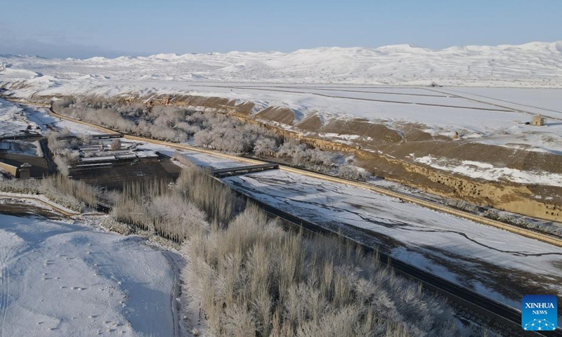 Aerial photo taken on March 25, 2022 shows the snow view of the Mogao Grottoes, a world cultural heritage site, in Dunhuang, northwest China's Gansu Province.Photo:Xinhua