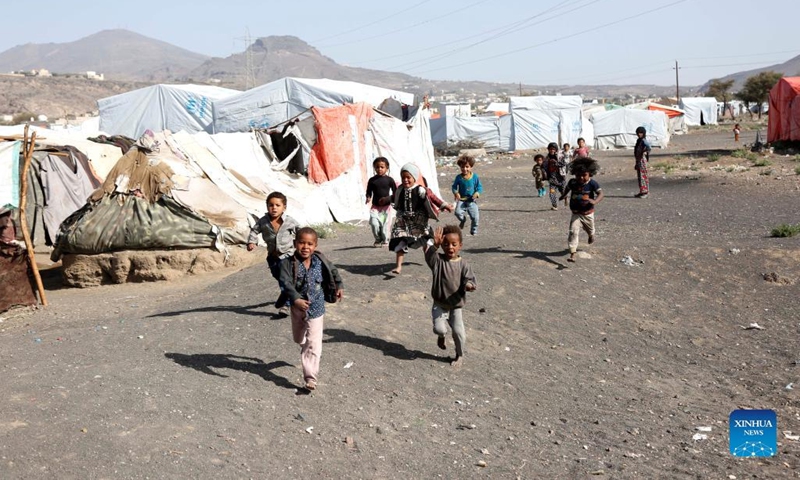 Children play at the Dharawan camp for internally displaced persons (IDPs) near Sanaa, Yemen, on March 25, 2022. Yemen has been mired in a civil war since late 2014 when the Iran-backed Houthi militia seized control of several northern provinces and forced the Saudi-backed Yemeni government of President Abd-Rabbu Mansour Hadi out of the capital Sanaa.(Photo: Xinhua)