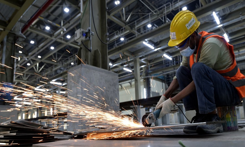 An employee works at the main depot of a metro line in Dhaka, Bangladesh on March 10, 2022.Photo:Xinhua