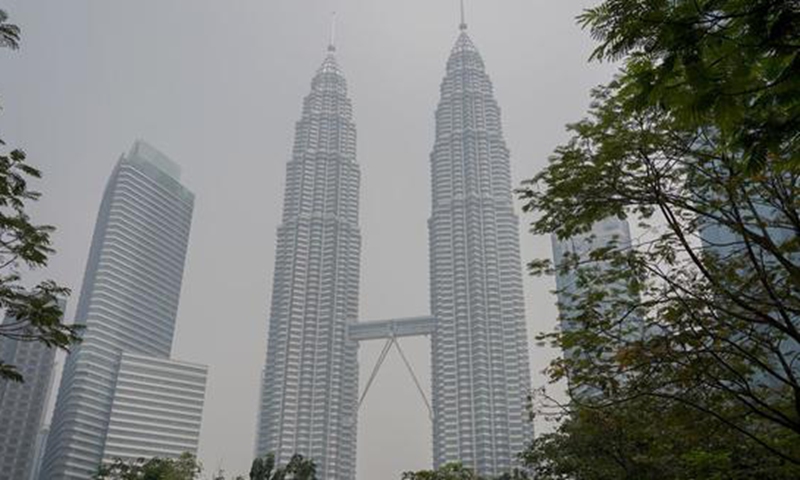 Petronas Twin Towers are shrouded in haze in Kuala Lumpur, Malaysia, Sept. 10, 2019.(Xinhua/Zhu Wei)