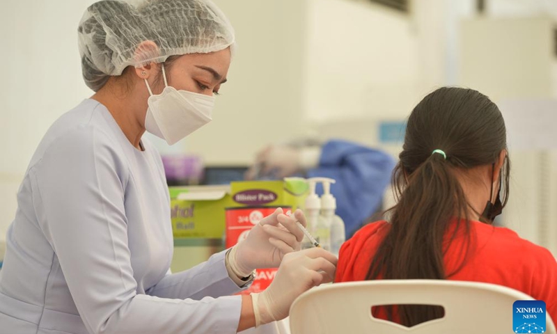 A woman receives a dose of the COVID-19 vaccine in Bangkok, Thailand, on April 4, 2022. (Xinhua/Rachen Sageamsak)