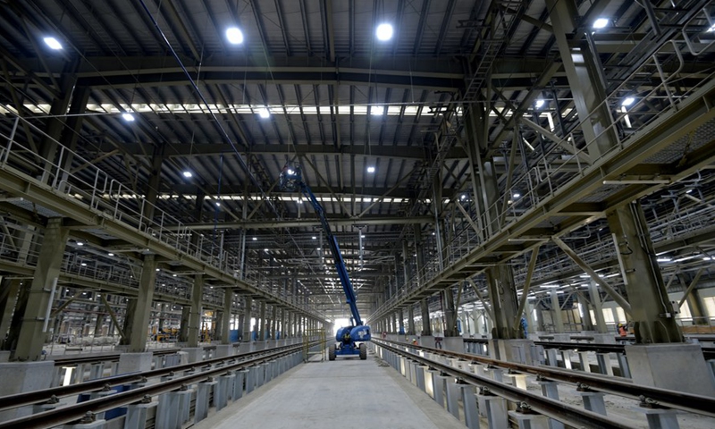 An employee works at the main depot of a metro line in Dhaka, Bangladesh on March 10, 2022.Photo:Xinhua