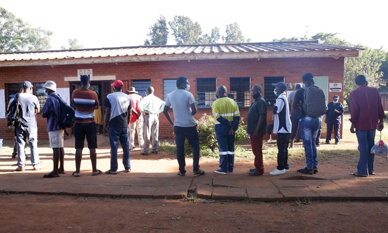 People queue up to vote at a polling station in Harare, Zimbabwe, on March 26, 2022.Photo:Xinhua