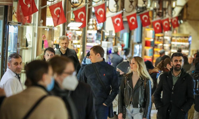 Tourists shop at the Spice Bazaar in Istanbul, Turkey, April 5, 2022. (Photo by Unal Cam/Xinhua)