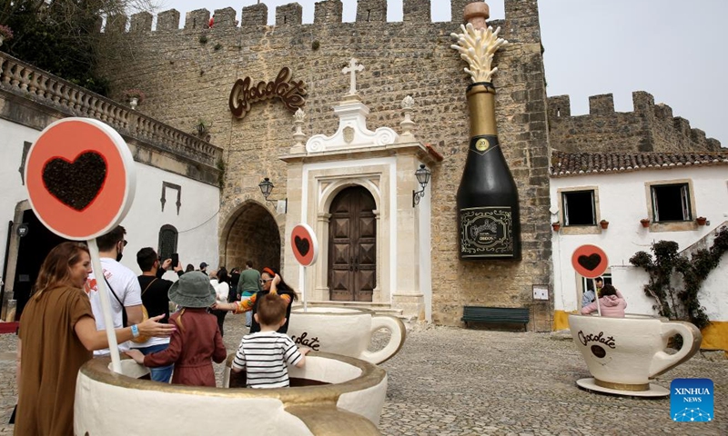 People take part in the 2022 Obidos International Chocolate Festival in Obidos, Portugal, on March 26, 2022.Photo:Xinhua