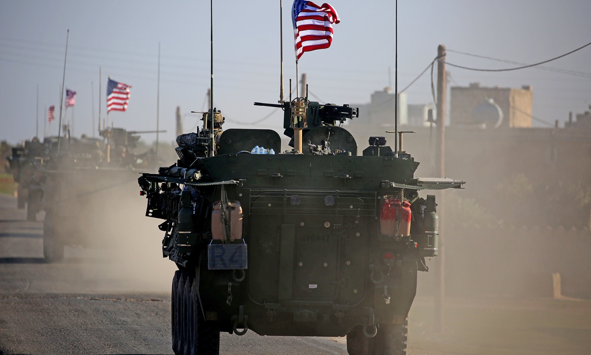 A US armored vehicle drives near the village of Yalanli, on the western outskirts of the northern Syrian city of Manbij on March 5, 2017. Photo: VCG
