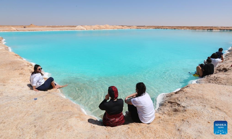 People enjoy themselves by a salt lake at Siwa Oasis in Matrouh Governorate, Egypt, on March 26, 2022.Photo:Xinhua