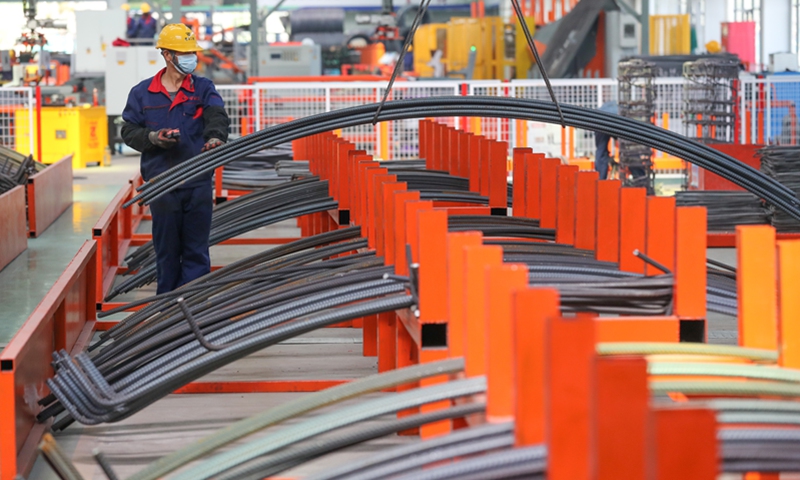 A worker works in a factory in the Deqing Green Building Industrial Park in Huzhou, East China's Zhejiang Province, on April 6, 2022. As the largest comprehensive green transportation engineering industrial base in northern Zhejiang, the park fabricates new materials such as subway segments and prefabricated components for railways. Right now, the park is manufacturing components for an intercity railway between Hangzhou and Deqing. Photo: cnsphoto