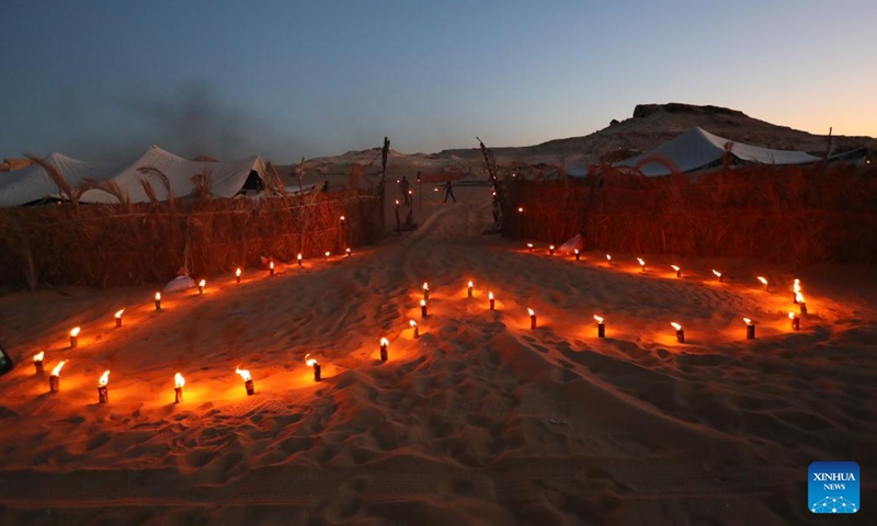 Photo taken on March 25, 2022 shows the entrance to a desert camp site around Siwa Oasis in Matrouh Governorate, Egypt. Siwa Oasis, in Egypt's Western Desert, is a renowned tourist destination in Egypt for its natural landscapes, historical ruins and cultural traditions.(Photo: Xinhua)