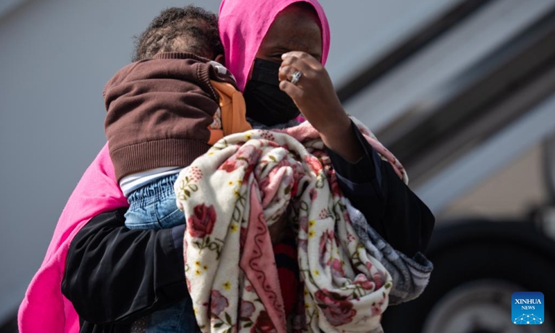 A woman and a child returning from Saudi Arabia arrive at Addis Ababa Bole International Airport in Addis Ababa, Ethiopia, on March 30, 2022.(Photo: Xinhua)