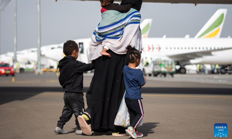 A woman and children returning from Saudi Arabia arrive at Addis Ababa Bole International Airport in Addis Ababa, Ethiopia, on March 30, 2022.(Photo: Xinhua)