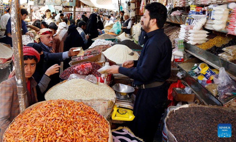 Yemenis shop at a market ahead of the upcoming Ramadan in Sanaa, Yemen, on March 31, 2022. (Photo: Xinhua)