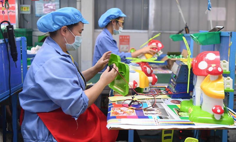 Workers make toys at a plastic product factory in Zhangjiajie, central China's Hunan Province, May 27, 2020.Photo:Xinhua