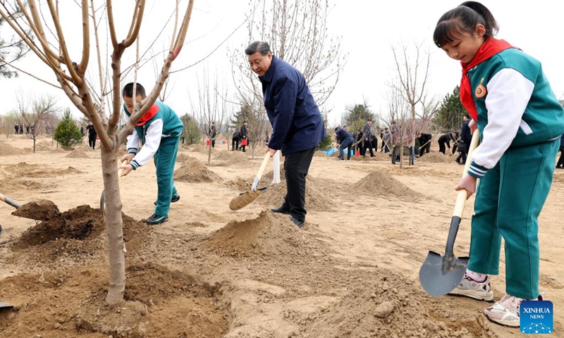 Chinese President Xi Jinping, also general secretary of the Communist Party of China Central Committee and chairman of the Central Military Commission, plants a tree during a tree-planting activity in Daxing District of Beijing, capital of China, March 30, 2022. The activity was also attended by other leaders including Li Keqiang, Li Zhanshu, Wang Yang, Wang Huning, Zhao Leji, Han Zheng and Wang Qishan.(Photo: Xinhua)