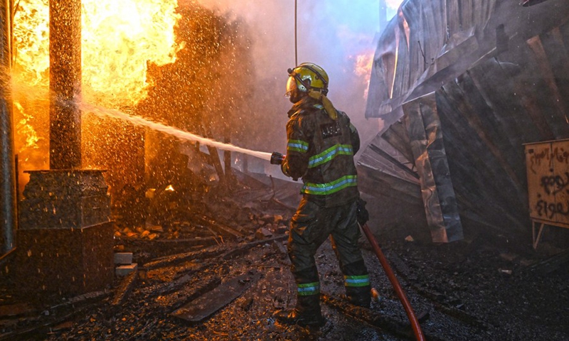 A firefighter tries to extinguish a fire at Al-Mubarakiya market in Kuwait City, Kuwait, on March 31, 2022.(Photo: Xinhua)