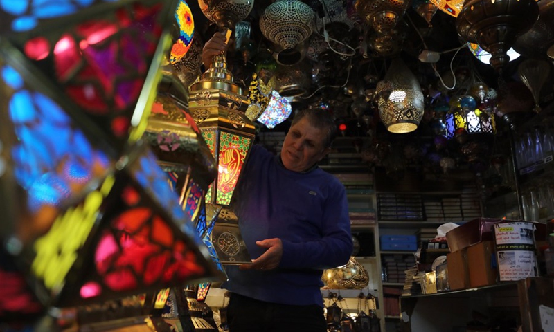 A Palestinian man sells Ramadan lanterns in Jerusalem's Old City, March 31, 2022.(Photo: Xinhua)