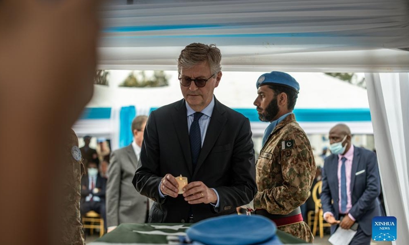 UN Under-Secretary-General for Peacekeeping Operations Jean-Pierre Lacroix (Front) holds a candle at a memorial service in Goma, the Democratic Republic of the Congo (DRC), on April 2, 2022.Photo:Xinhua