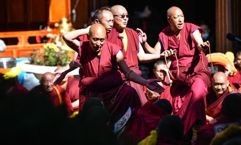 Monks attend the debate activity, a part of the award ceremony of the degree of Geshe Lharampa held in the Jokhang Temple in Lhasa, capital of southwest China's Tibet Autonomous Region, April 2, 2022.Photo:Xinhua