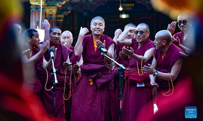 Monks attend the debate activity, a part of the award ceremony of the degree of Geshe Lharampa held in the Jokhang Temple in Lhasa, capital of southwest China's Tibet Autonomous Region, April 2, 2022.Photo:Xinhua