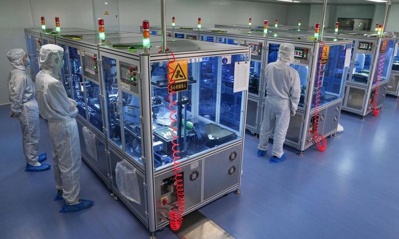 Staff members work at a production line of COVID-19 self-testing kits at Biouhan healthcare company in Hefei, east China's Anhui Province, March 29, 2022.Photo:Xinhua