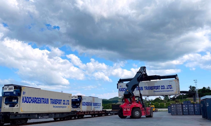 The containers of fruits from Thailand are transported from China-Laos Railway cargo train to trucks at Nateuy Station in Luang Namtha Province, Laos, April 1, 2022.Photo:Xinhua