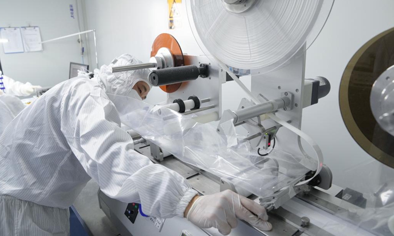 A staff member works at a production line of COVID-19 self-testing kits at Biouhan healthcare company in Hefei, east China's Anhui Province, March 29, 2022.Photo:Xinhua
