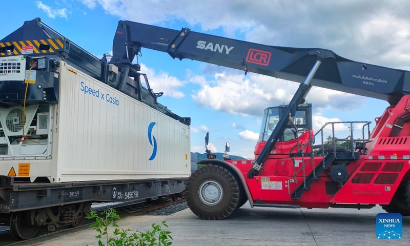 A container of fruits from Thailand is transported from China-Laos Railway cargo train to a truck at Nateuy Station in Luang Namtha Province, Laos, April 1, 2022.Photo:Xinhua