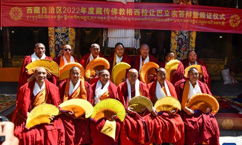 Monks awarded the degree of Geshe Lharampa pose for a group photo in the Jokhang Temple in Lhasa, capital of southwest China's Tibet Autonomous Region, April 2, 2022.Photo:Xinhua