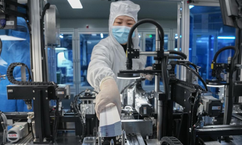 A staff member works at a production line of COVID-19 self-testing kits at Biouhan healthcare company in Hefei, east China's Anhui Province, March 29, 2022.Photo:Xinhua