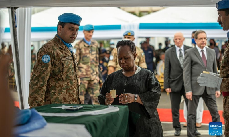 Bintou Keita (C), top UN envoy in the Democratic Republic of the Congo (DRC), holds a candle at a memorial service in Goma, DRC, on April 2, 2022.Photo:Xinhua