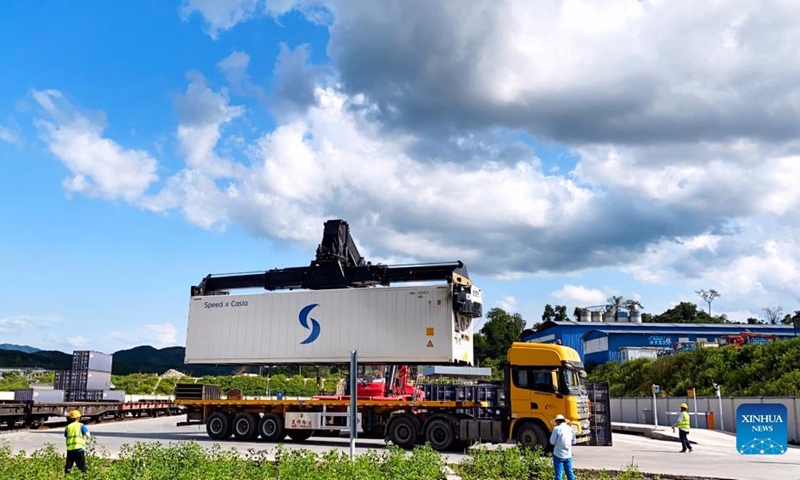 A container of fruits from Thailand is transported from China-Laos Railway cargo train to a truck at Nateuy Station in Luang Namtha Province, Laos, April 1, 2022.Photo:Xinhua