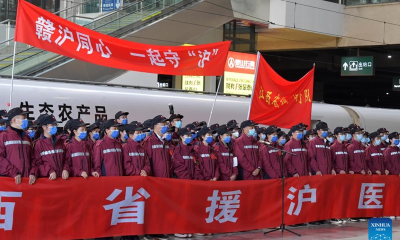 Medical workers are seen before setting out for Shanghai at Nanchang Railway Station in Nanchang, east China's Jiangxi Province, April 3, 2022. A team of medical workers left Jiangxi Province Sunday for Shanghai to help aid the COVID-19 control efforts there. (Xinhua)