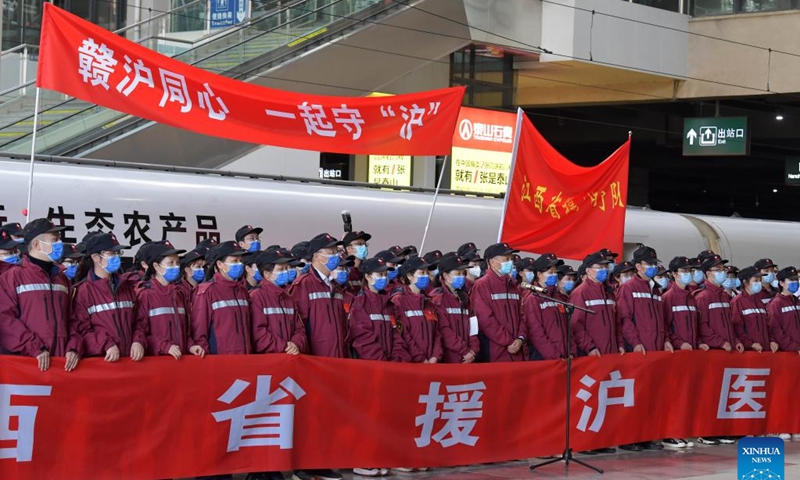 Medical workers are seen before setting out for Shanghai at Nanchang Railway Station in Nanchang, east China's Jiangxi Province, April 3, 2022. A team of medical workers left Jiangxi Province Sunday for Shanghai to help aid the COVID-19 control efforts there. Photo: Xinhua