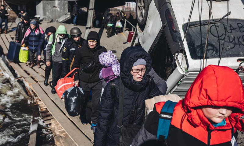 People evacuate in Irpin, Ukraine, March 11, 2022. Photo: Xinhua  