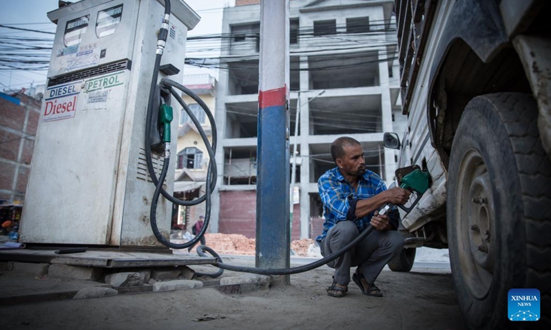 A man refuels his vehicle at a gas station in Lalitpur, Nepal, April 6, 2022. Fuel prices in Nepal saw an increase recently.(Photo: Xinhua)