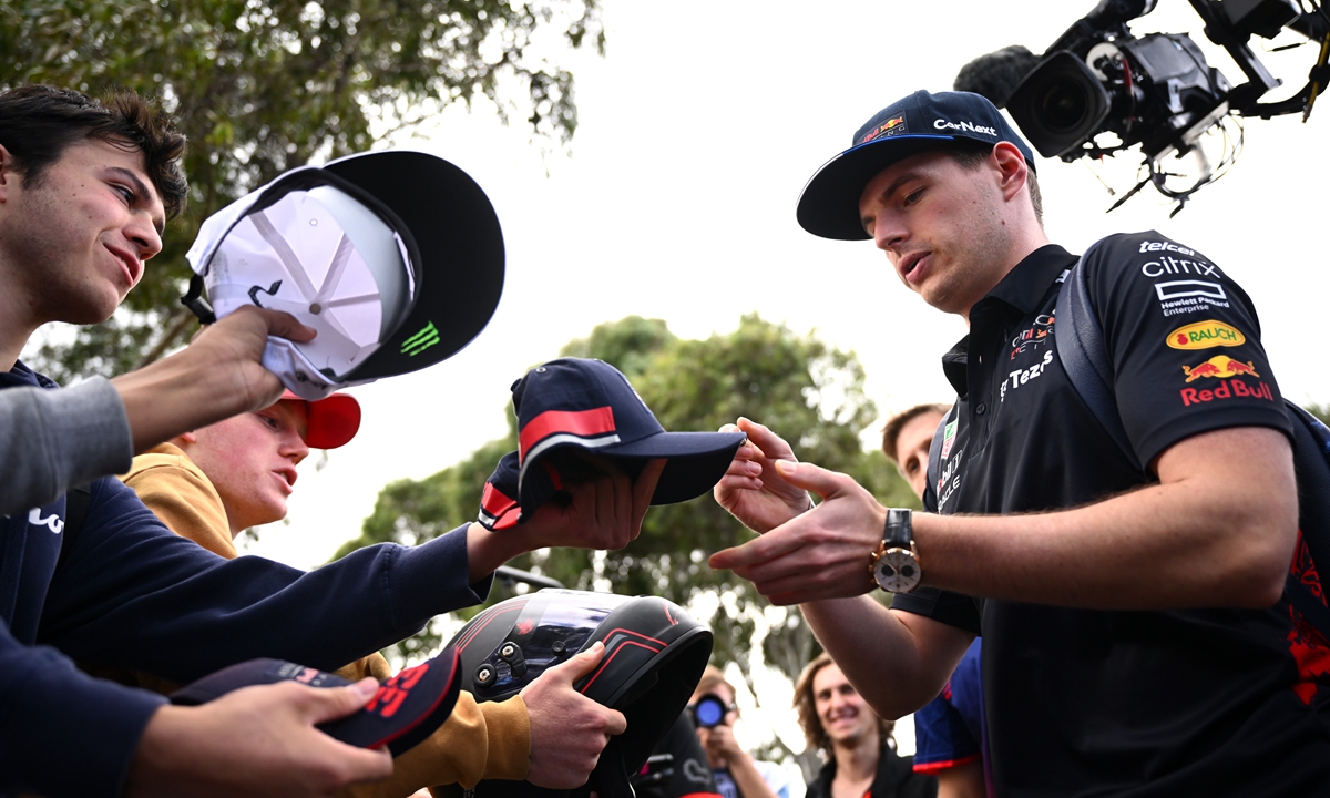 Red Bull driver Max Verstappen signs autographs for fans ahead of the F1 Grand Prix of Australia at Melbourne Grand Prix Circuit on April 7, 2022 in Melbourne, Australia. Photo: VCG