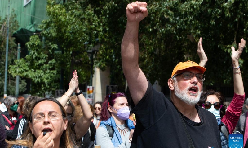 Demonstrators shout slogans in downtown Athens, Greece, on April 6, 2022. Tens of thousands of Greeks walked off the job across the country on Wednesday to join a 24-hour general strike over soaring heating, electricity and housing costs. Public services and transport were disrupted. (Photo: Xinhua)