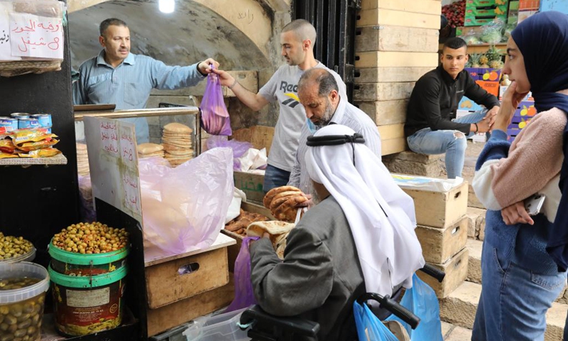People shop for food during Ramadan in Jerusalem's Old City, on April 6, 2022.(Photo: Xinhua)