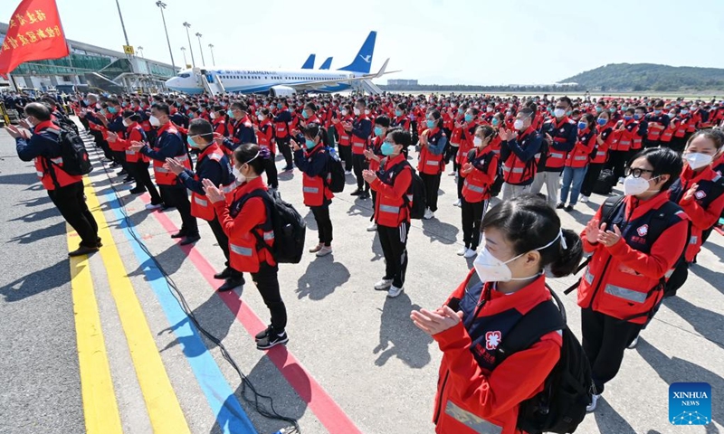 Medics gather before boarding for east China's Shanghai at Changle Airport in Fuzhou, southeast China's Fujian Province, April 7, 2022. A total of 1,730 supportive medics from Fujian Province set off on Thursday from Fuzhou and Xiamen to Shanghai to aid in the battle against the resurging COVID-19 epidemic.Photo:Xinhua