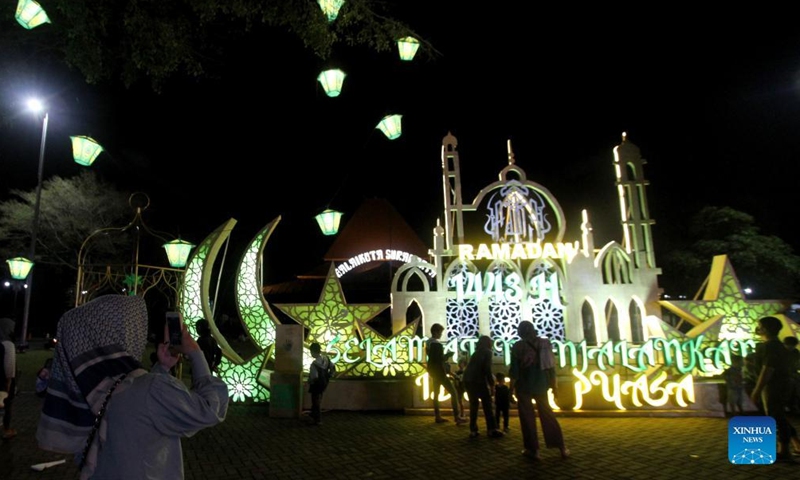 People view illuminated installations during the holy month of Ramadan in Surakarta, Central Java, Indonesia, April 9, 2022.Photo:Xinhua