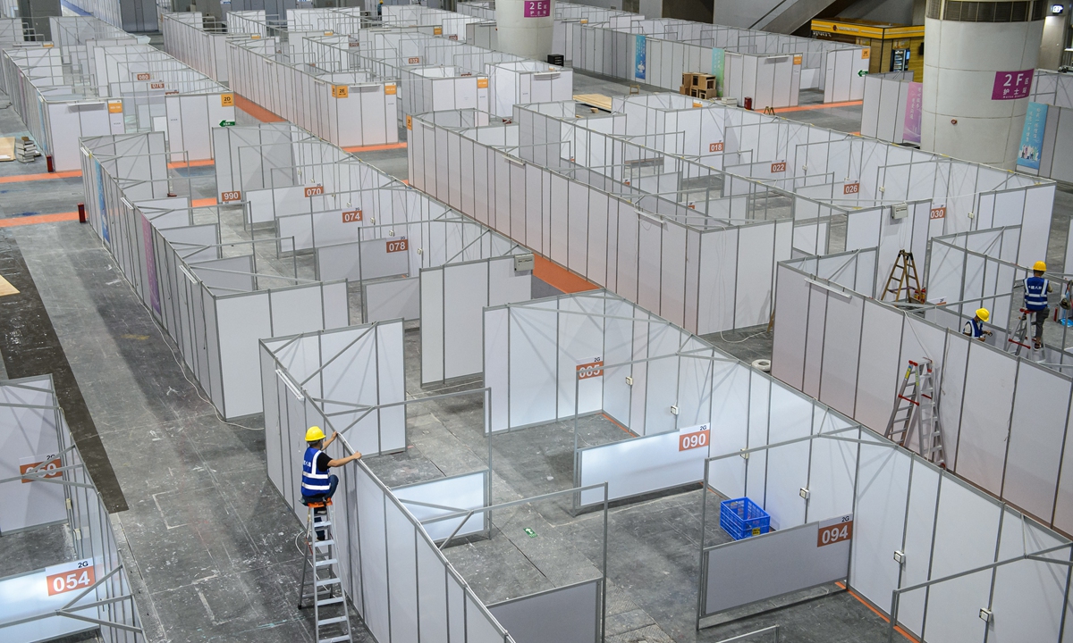 Workers rush to build a makeshift hospital at Pazhou International Convention and Exhibition Center in Guangzhou, South China's Guangdong Province, on Monday. Photo: VCG  