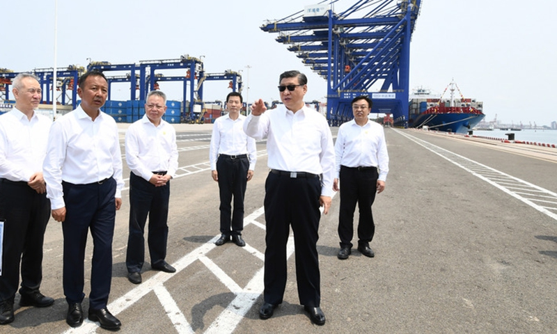 Chinese President Xi Jinping, also general secretary of the Communist Party of China Central Committee and chairman of the Central Military Commission, visits a container terminal of the Yangpu economic development zone in Danzhou, south China's Hainan Province, April 12, 2022. (Xinhua/Xie Huanchi)