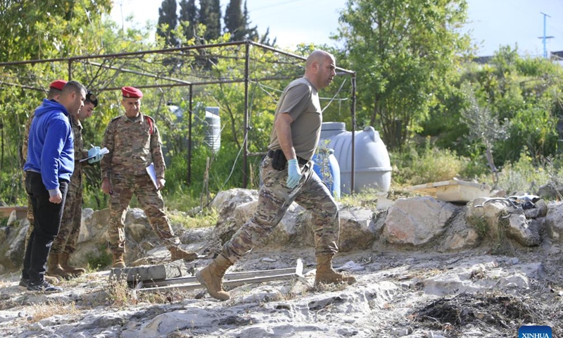 Soldiers are seen near the building that was destroyed in the explosion in Benafoul, Lebanon, April 12, 2022. Photo: Xinhua