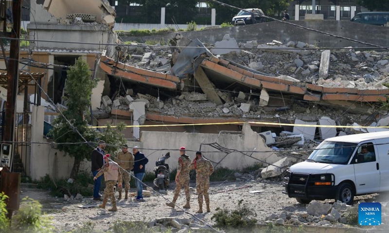 Soldiers are seen near the building that was destroyed in the explosion in Benafoul, Lebanon, April 12, 2022. Photo: Xinhua