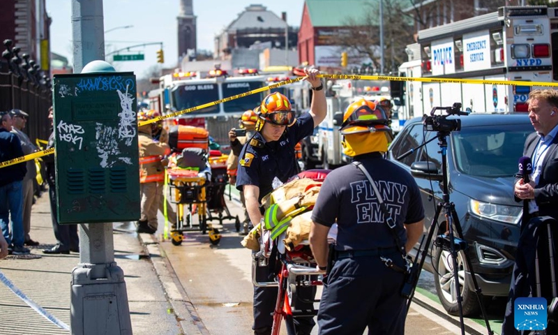 First responders work at a nearby street after a shooting took place at a subway station in Brooklyn, New York, the United States, on April 12, 2022. At least five people were shot and 13 were injured on Tuesday morning at the subway station in Brooklyn, local media reported, citing law enforcement sources.(Photo: Xinhua)